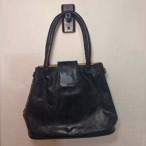 Laila, Essence of Norway GEIR NESS purse bag.